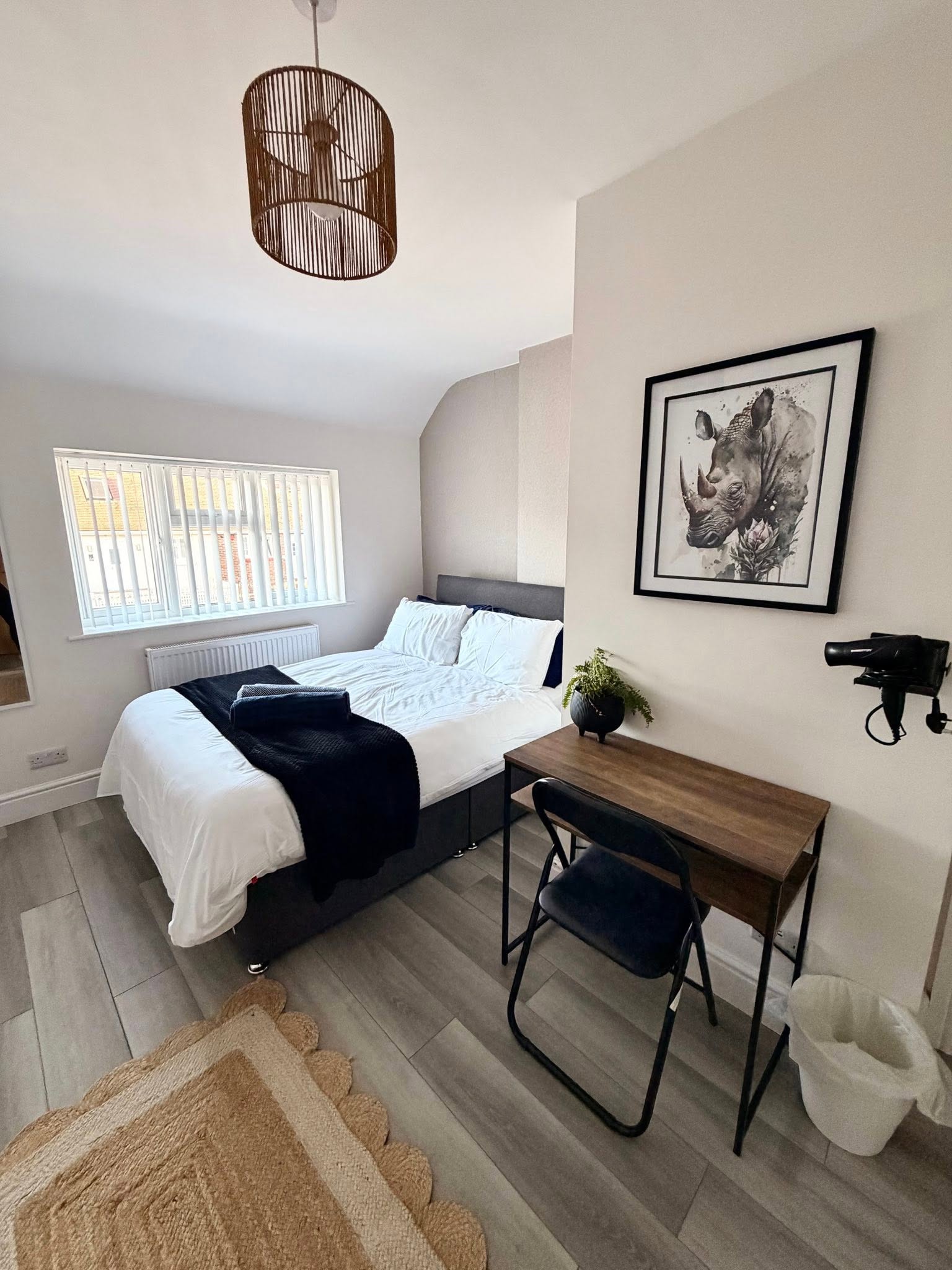 A neatly made bed in a clean bedroom